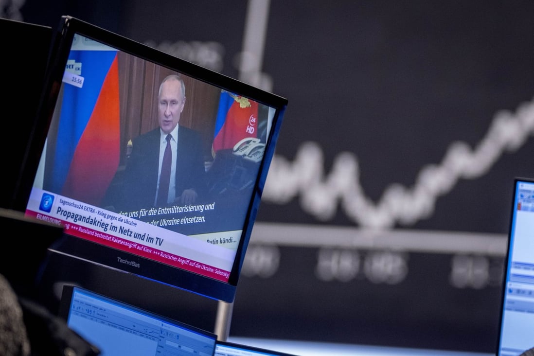 Russian President Vladimir Putin is seen on a TV screen at the stock market in Frankfurt, Germany, on February 25. Photo: AP