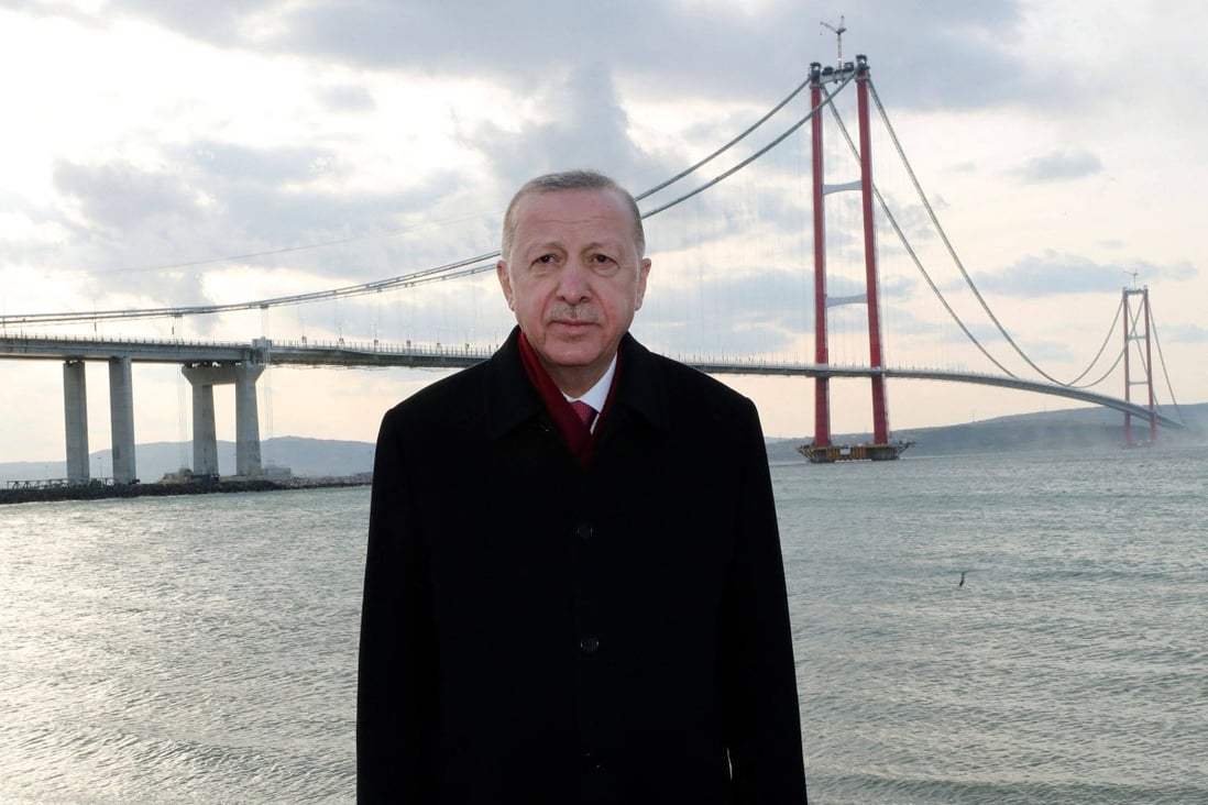 Turkey’s President Recep Tayyip Erdogan poses for photos during the inauguration of the 1915 Canakkale Bridge, in Canakkale, western Turkey. The structure connects Europe with Asia and is the world’s longest midspan suspension bridge. Photo: Handout/Turksih Presidency Press Office/AFP