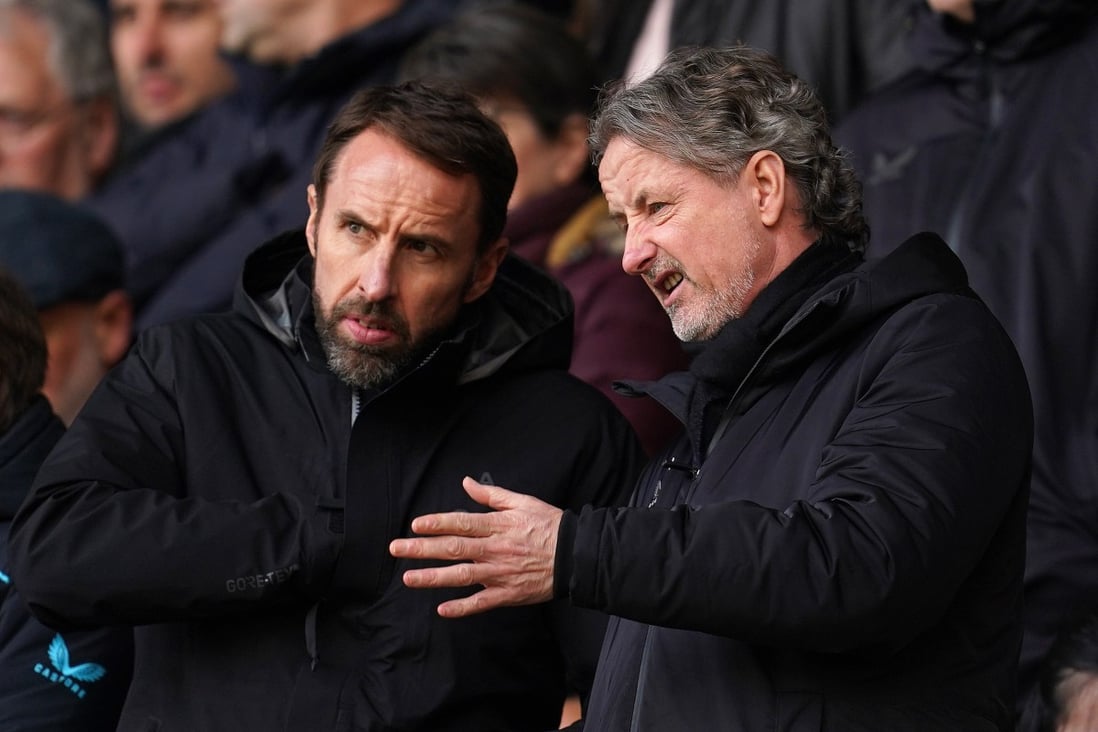 England manager Gareth Southgate (left) chats with Wolverhampton Wanderers technical director Scott Sellars during a Premier League game at Molineux Stadium. Photo: DPA