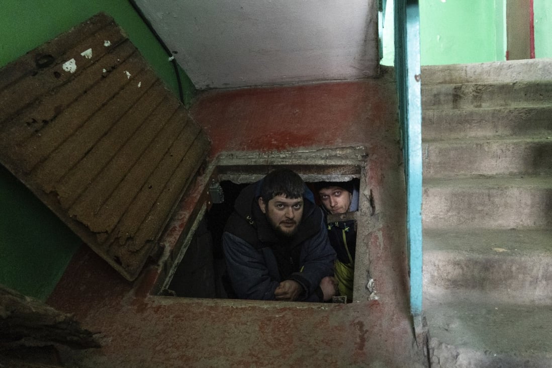 People hide in an improvised bomb shelter in Mariupol, Ukraine. Photo: AP