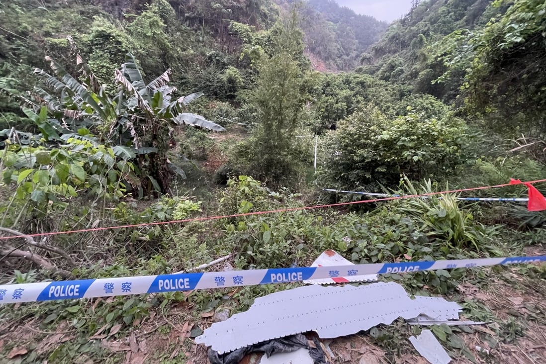 A photo taken with a mobile phone shows pieces of wreckage from a crashed passenger plane found at a crash site in Teng County in southern China’s Guangxi Zhuang autonomous region on Tuesday. Photo: Xinhua