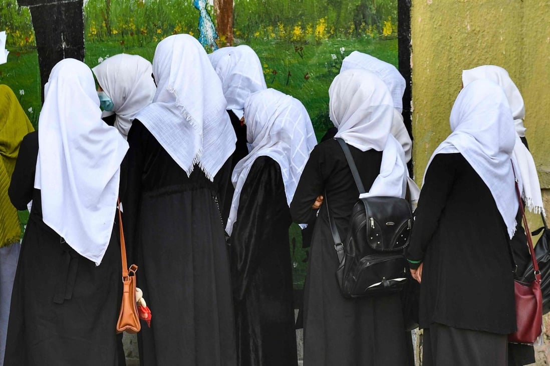 Girls arrive at their school in Kabul on Wednesday. Hours later, they were ordered to go home. Photo: AFP 