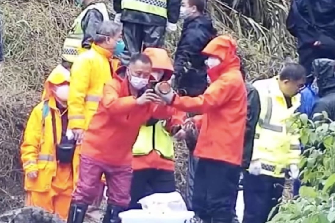 One of the black box flight recorders is recovered from the crash site in Guangxi on Wednesday. Photo: Xinhua News/Weibo
