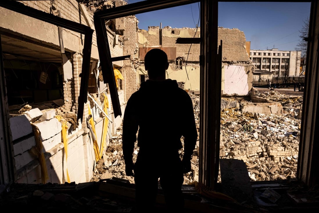 A man stands inside a damaged school in the city of Zhytomyr, northern Ukraine, on Wednesday. Photo: AFP