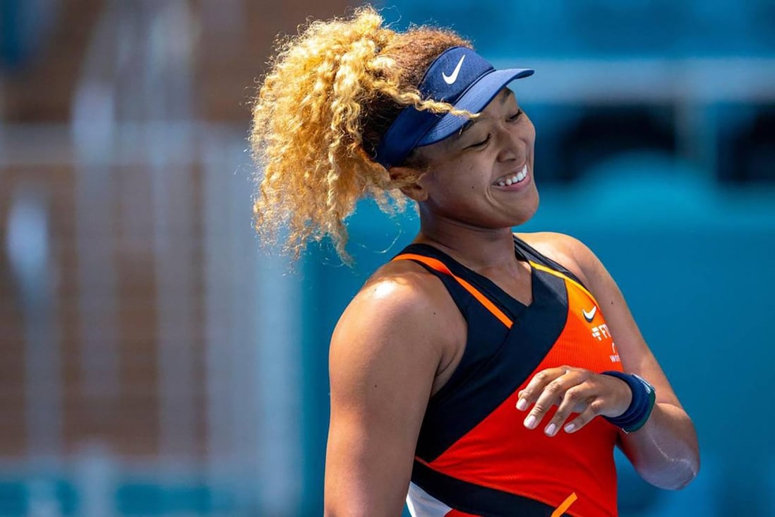 Naomi Osaka of Japan reacts after scoring a point against Astra Sharma of Australia during their first round match at the Miami Open. Photo: TNS