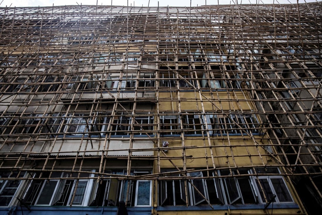 Bamboo scaffolding covers an old residential building in Hong Kong on March 18. Photo: AFP