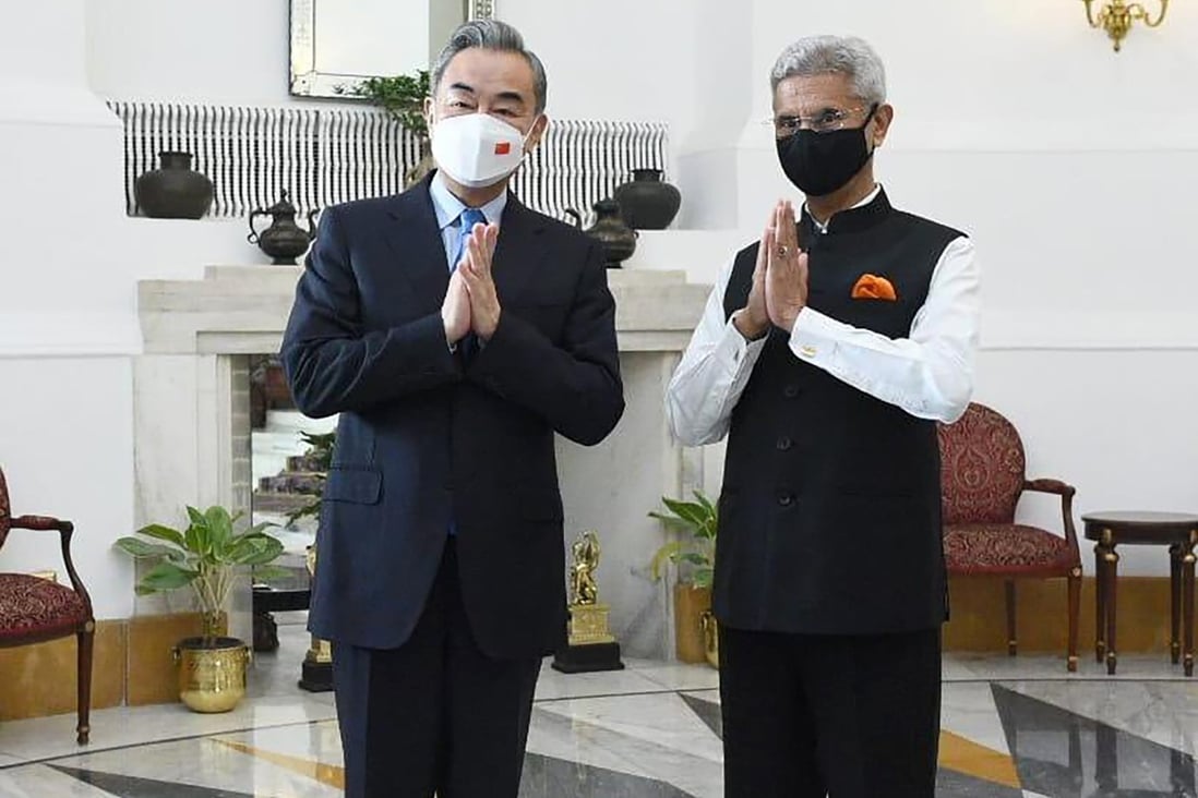 Indian foreign minister S. Jaishankar and his Chinese counterpart Wang Yi greet the media before their meeting in New Delhi, on Friday. Photo: Twitter/@DrSJaishankar via AP