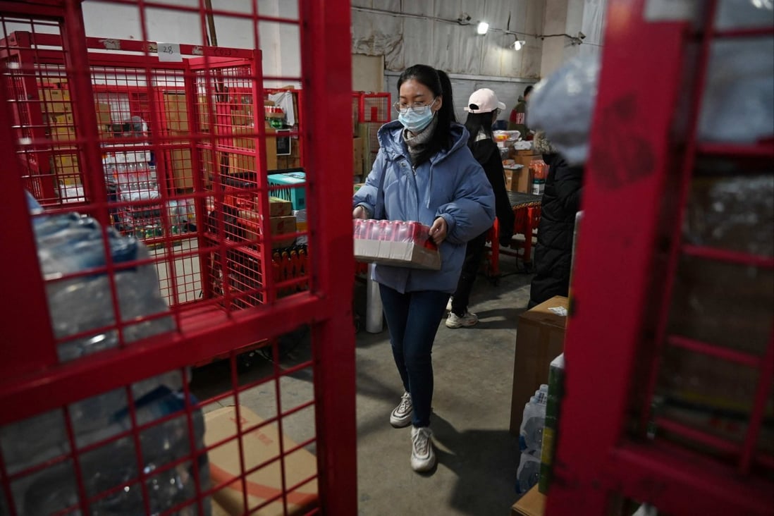 A worker prepares a package for delivery at a JD.com distribution centre. Photo: AFP