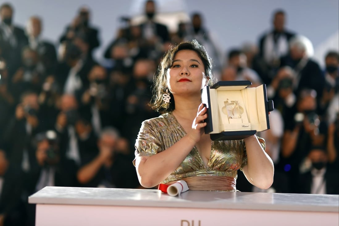 Hong Kong director Tang Yi poses with the Short Film Palme d’Or for her film “All the Crows in the World” at the Cannes Film Festival on July 17, 2021. The cultural and creative industries have become a focus of development in Hong Kong. Photo: EPA-EFE 