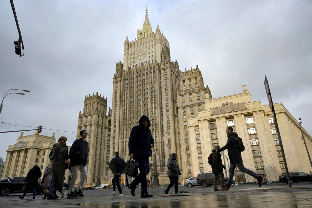 People walk past the Russian foreign ministry headquarters in Moscow on Tuesday. Photo: AFP