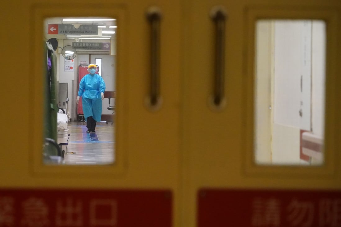 A staff member walks down the corridor of Queen Elizabeth Hospital’s Accident & Emergency Department on March 13. Photo: Felix Wong