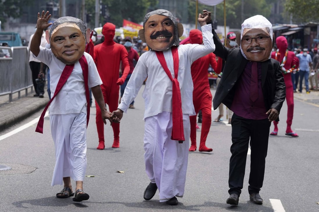 Members of the Socialist Youth Union, dressed as Sri Lankan president Gotabaya Rajapaksa and his brothers Basil and Mahinda, protest against the country’s worst economic crisis. Photo: AP