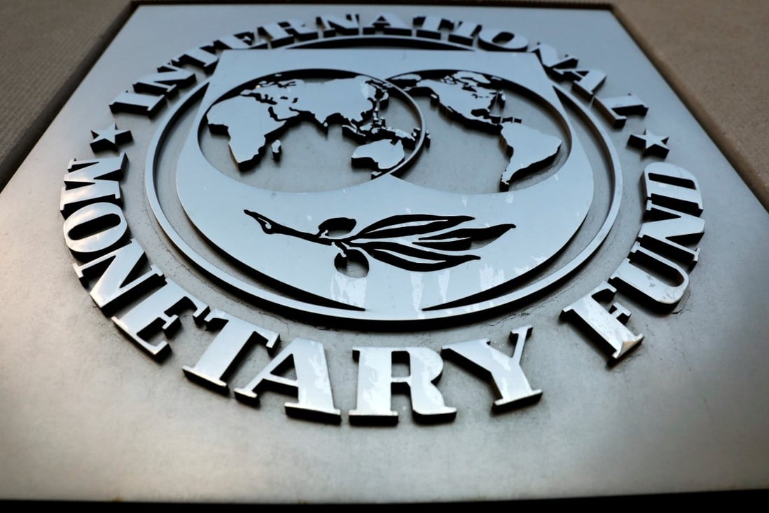 The International Monetary Fund (IMF) logo is seen outside the headquarters building in Washington. Photo: Reuters