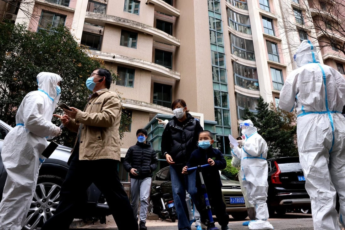 Volunteers guide residents arriving for Covid-19 tests in Shanghai’s Putuo district. The second phase of the city’s lockdown in areas to the west of the Huangpu River came into force on Friday. Photo: Xinhua