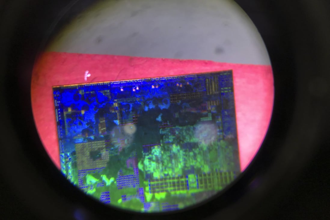 In this file photo taken May 17, 2018, a microchip developed by Tsinghua Unigroup is seen through a microscope. Photo: AP