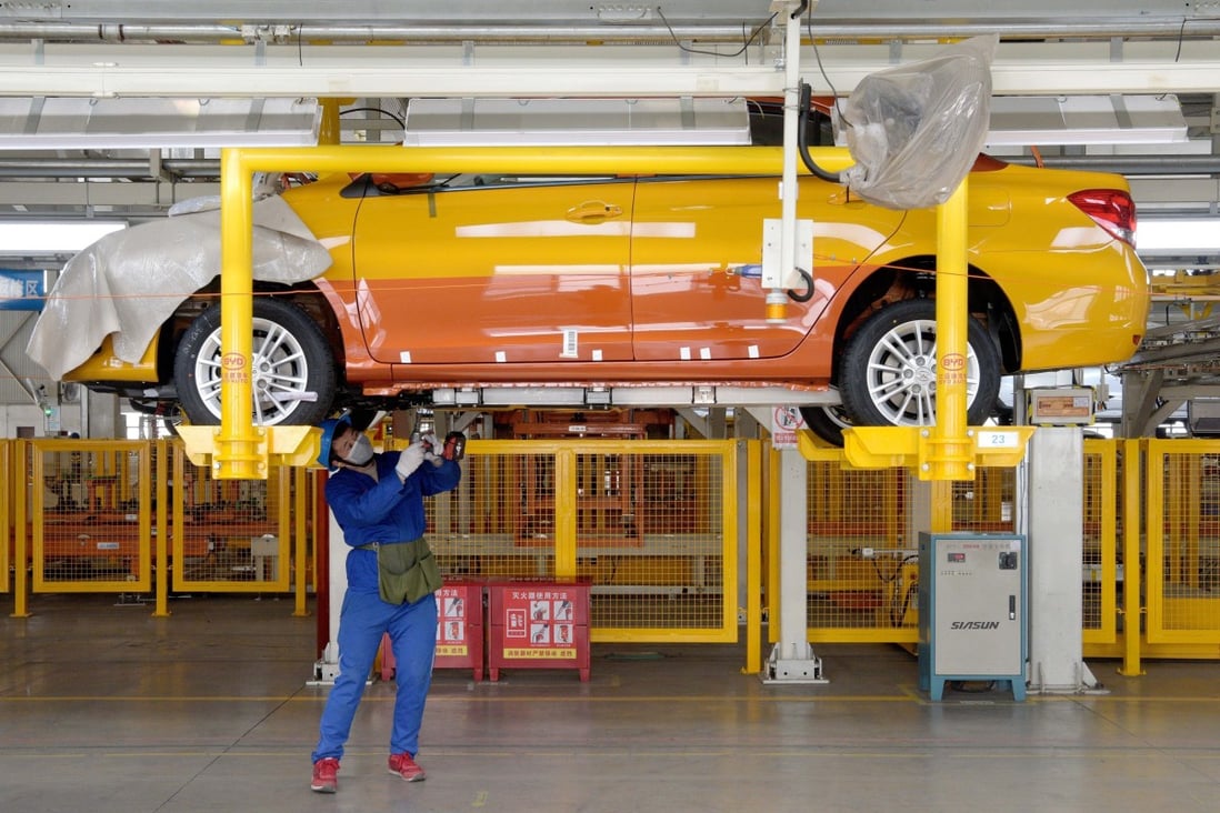 A worker works on the assembly line at a factory of vehicle manufacturer BYD in Xian. Photo: Xinhua