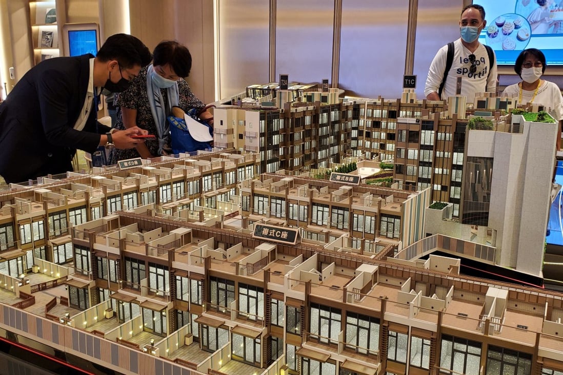 Potential homebuyers view a scale model of CK Asset’s #Lyos residential project in Hung Shui Kiu, New Territories. Photo: Edmond So