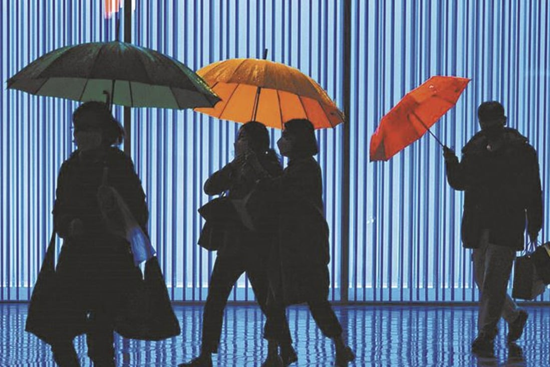 “Three Umbrellas” by street photographer Chae Kyung-wan, AKA K. Chae, one of the photos of South Korea’s capital that make up his “Not Seoul” exhibition. Photo: Courtesy of K. Chae.