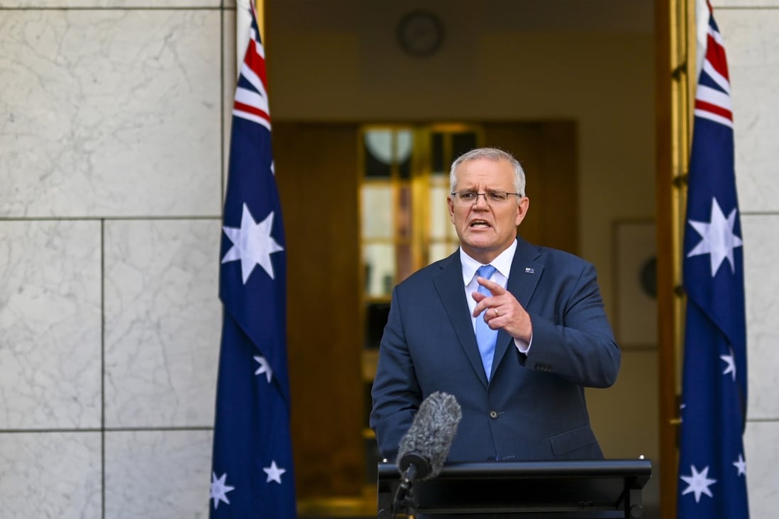 Australian Prime Minister Scott Morrison addresses the media in Canberra on Sunday. Photo: AAP Image via AP