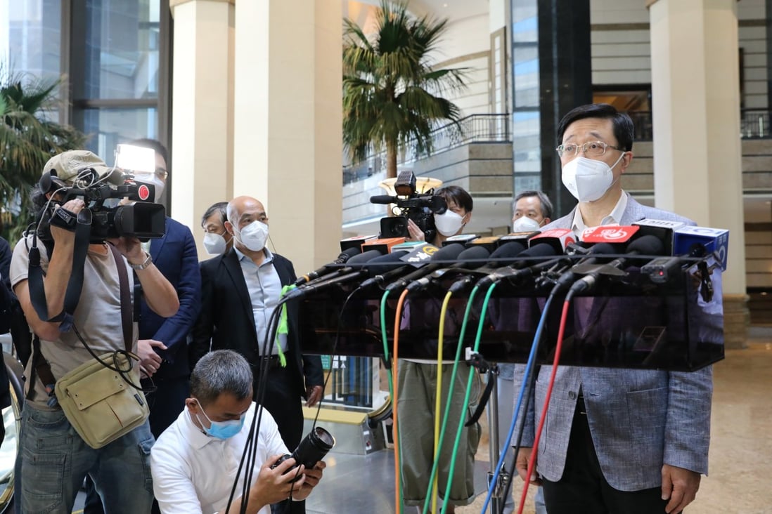 Chief executive hopeful John Lee meets the press at Central Plaza in Wan Chai on Sunday.    Photo: Jelly Tse