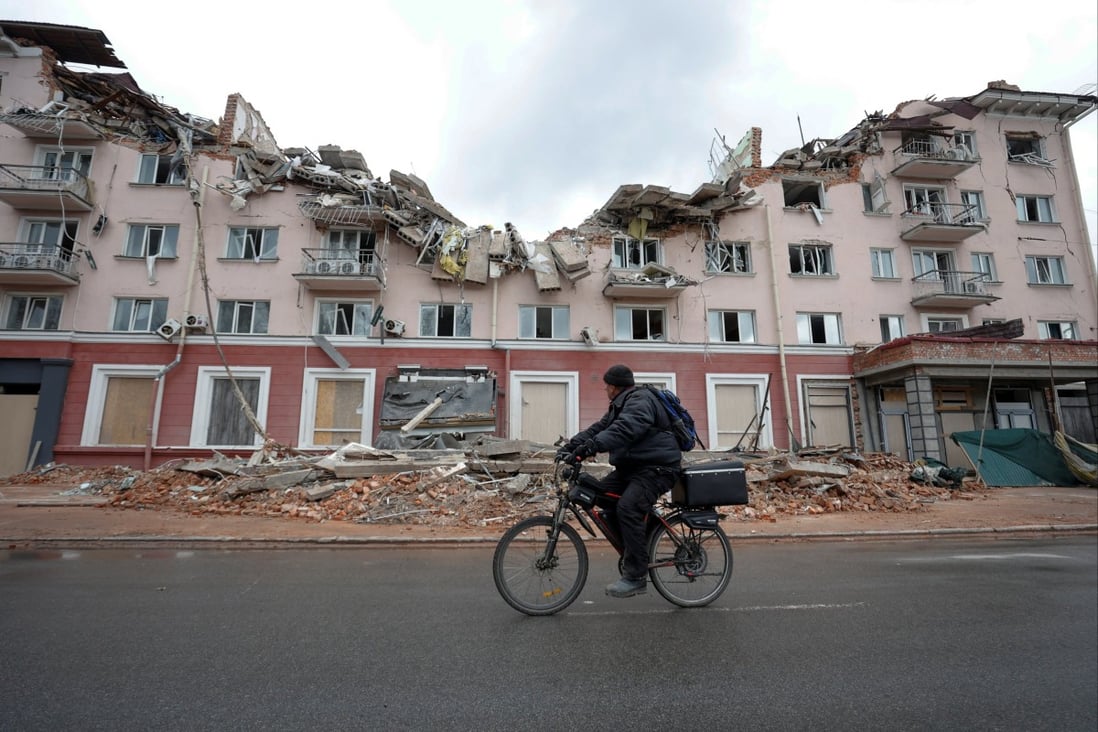 A man rides a bicycle past a hotel destroyed by a Russian airstrike in Chernihiv, Ukraine, this month. Photo: Reuters