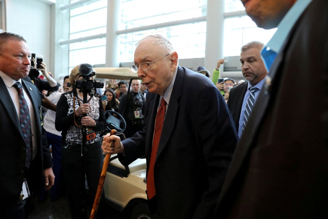Charlie Munger walks past a crowd at the annual Berkshire shareholder shopping day in Nebraska in May 2019. Photo: Reuters