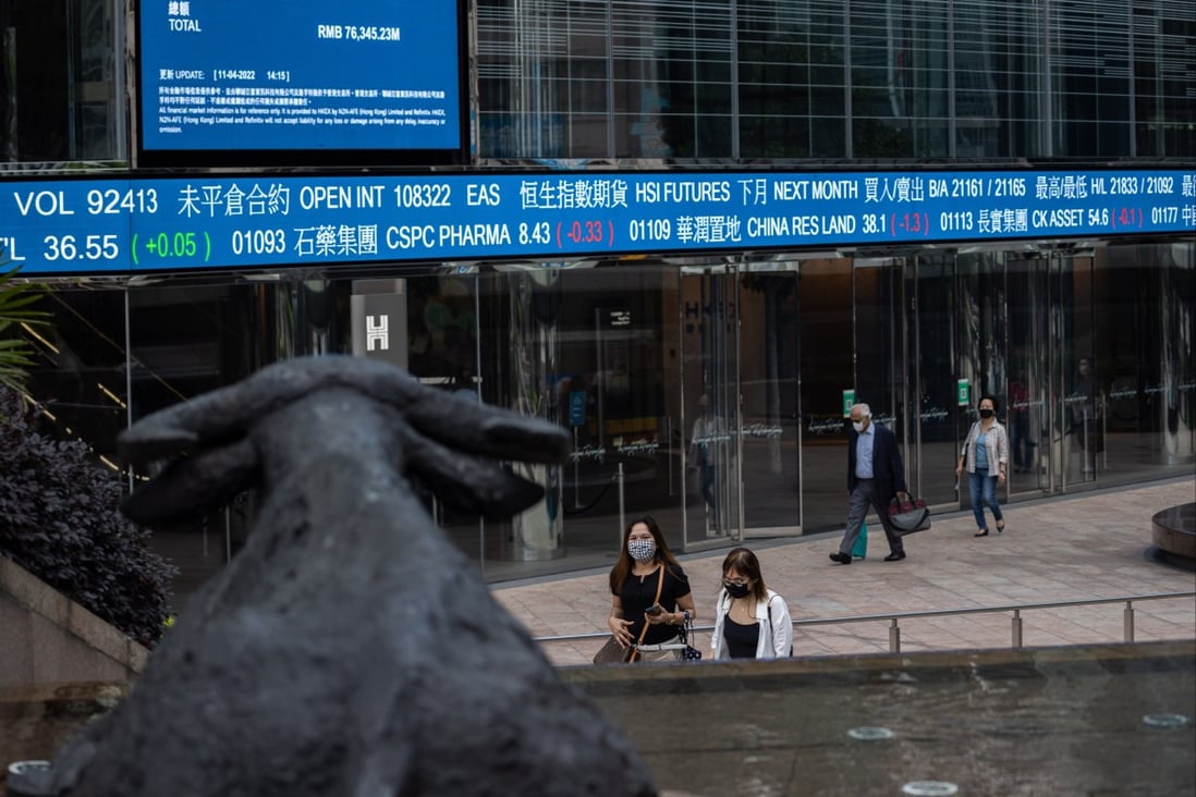 People walk past Exchange Square in Central, Hong Kong on April 11. Photo: EPA-EFE