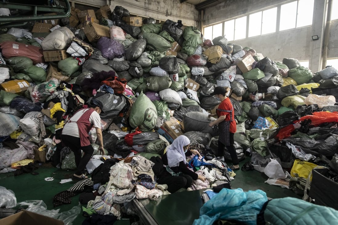 A facility operated by a second-hand clothing trading firm in Hangzhou. In 2020, China produced around 22 million tonnes of textile waste and recycled around 20 per cent of it.  Photo: Bloomberg