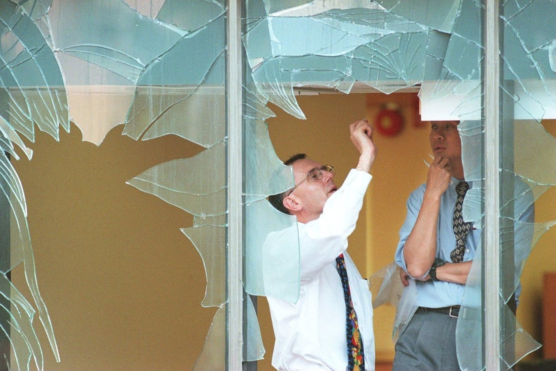 Hong Kong Police explosive experts retrieve bomb fragments from the food plaza of the Jusco store in Tuen Mun in 1999. Following the blast, a hoax caller threatened more bombings at its branches. Photo: Oliver Tsang