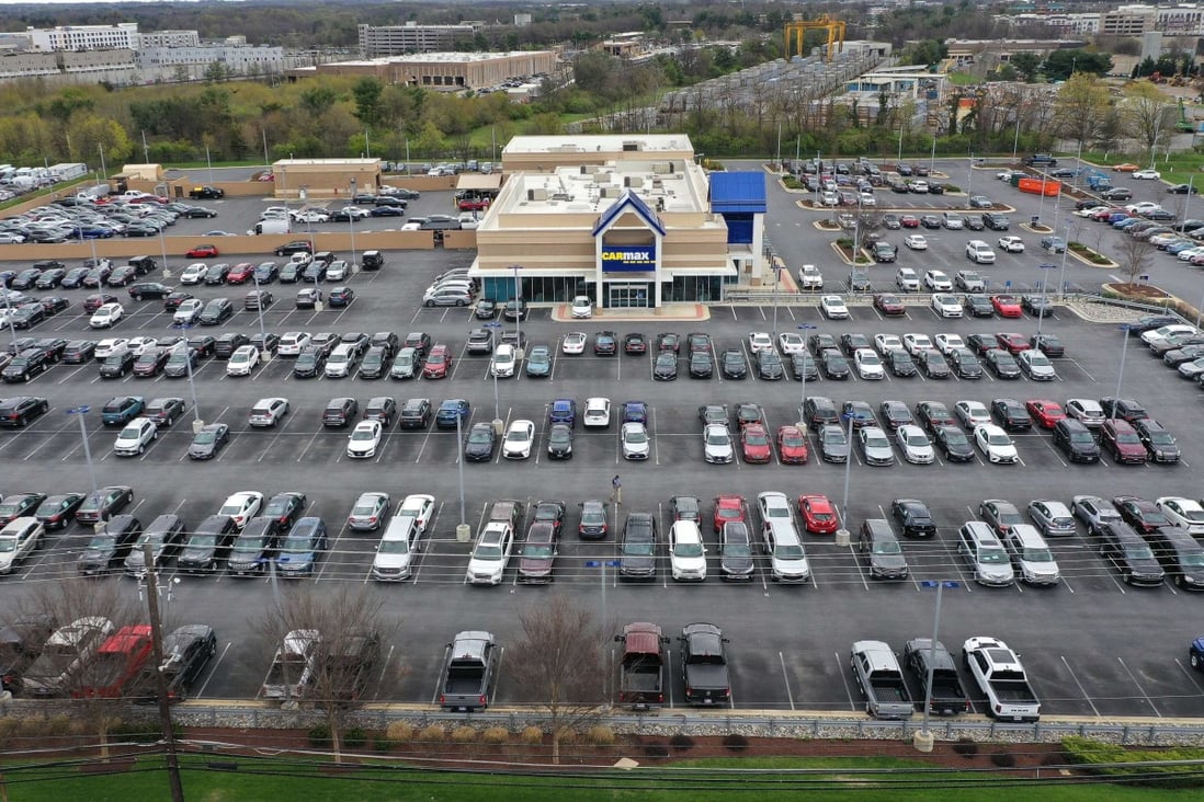 A CarMax lot in Gaithersburg, Maryland, holds hundreds of used vehicles on April 12. Supply chain disruptions have led to shortages of new and used vehicles that have driven up inflation, but there are signs that inflation in the United States has peaked or is near peaking. Photo: AFP