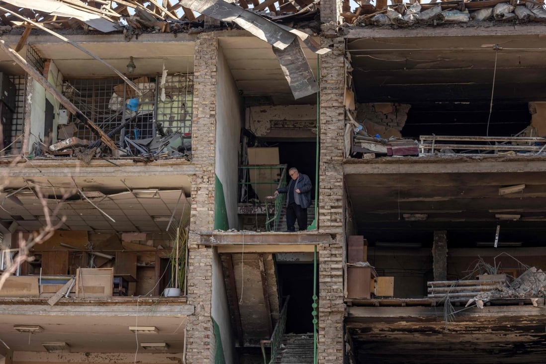 A man stands in a building with a collapsed facade at a military-industrial complex after the site was hit by overnight Russian strikes, in the southwestern suburbs of Kyiv. The factory produced missiles allegedly used to hit Russia’s Moskva warship. Photo: AFP