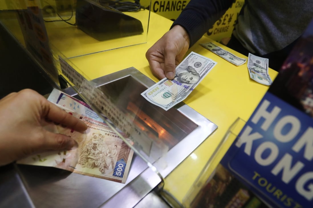 Hong Kong dollars are exchanged for US dollars at a currency exchange in Wan Chai in March 2018. Photo: Jonathan Wong