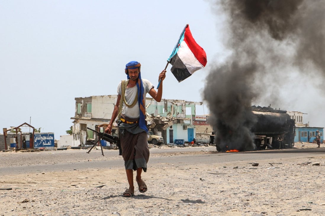 A UAE-trained fighter walks with a separatist flag during clashes in Yemen in 2019. Photo: AFP