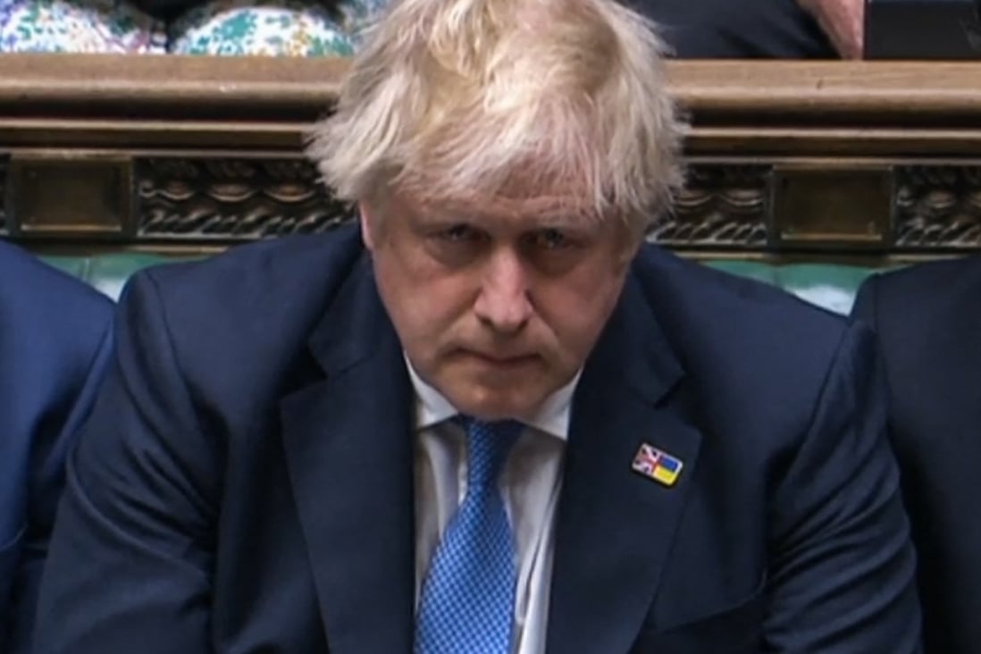 Britain’s Prime Minister Boris Johnson reacts after apologising to MPs for the for his “partygate” fine in the House of Commons in London on Tuesday. Photo: PRU via AFP