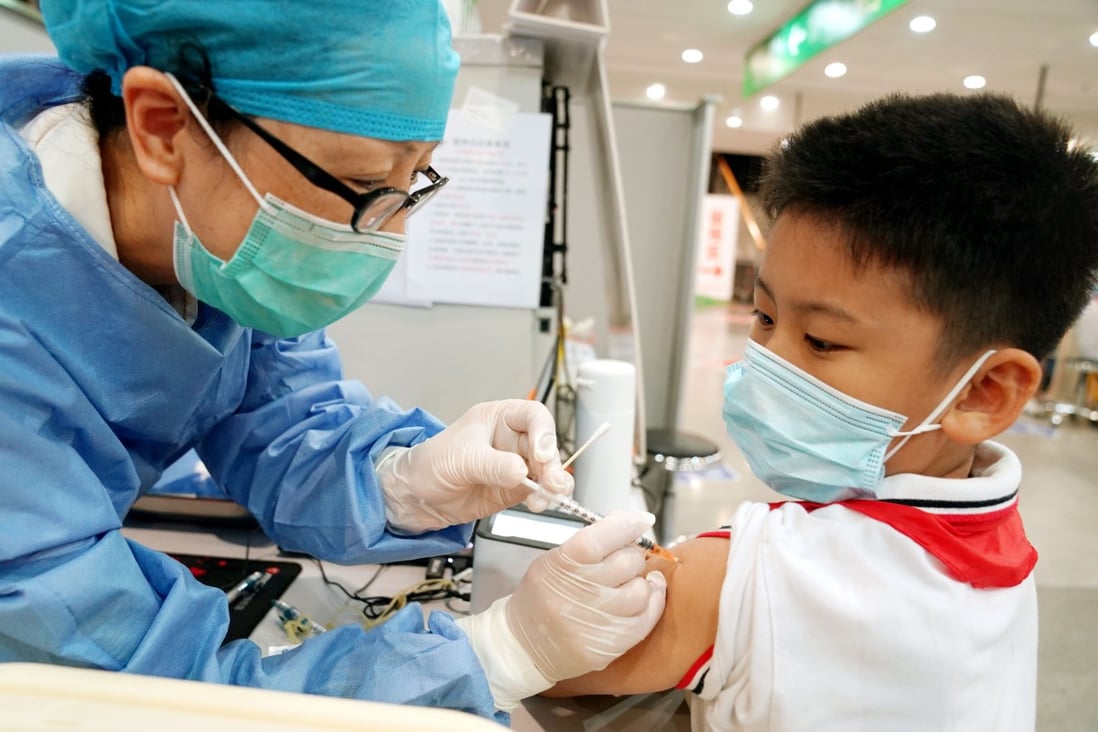 A medical worker administers a dose of the COVID-19 vaccine to a boy at a vaccination site in Xuhui District of Shanghai on Sept. 3, 2021. Photo: Xinhua