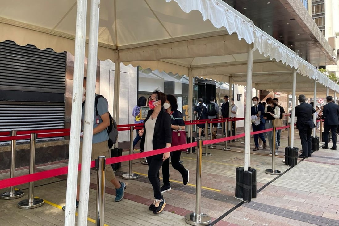 Prospective buyers queue up at The Grand Mayfair’s sales offices for a chance to own a flat in the development, where 388 flats went on sale on Friday. Photo: Ka Sing Lam
