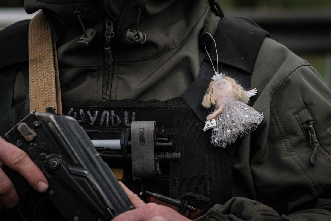 A Ukrainian soldier wears an angel ornament given to him by his daughter in Sloviansk, eastern Ukraine, on Friday. Photo: AFP