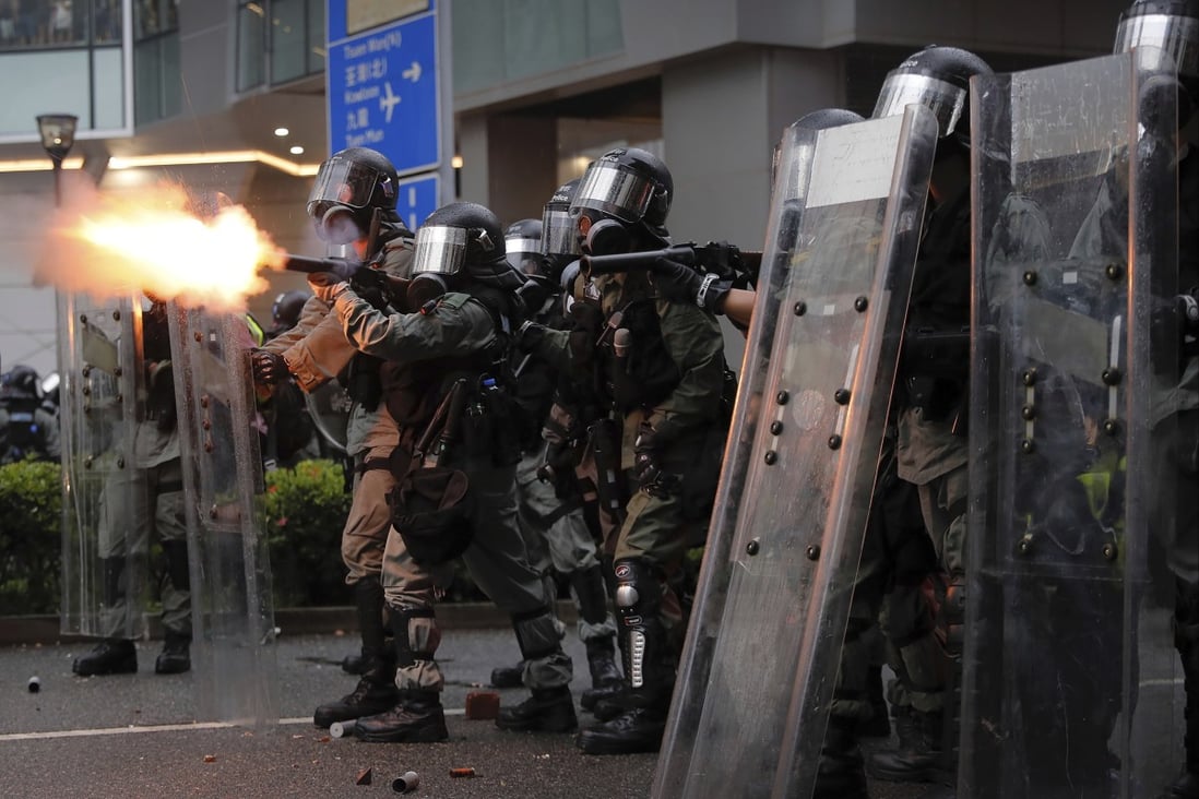 Riot police fire tear gas at protesters in Hong Kong in 2019. Photo: AP
