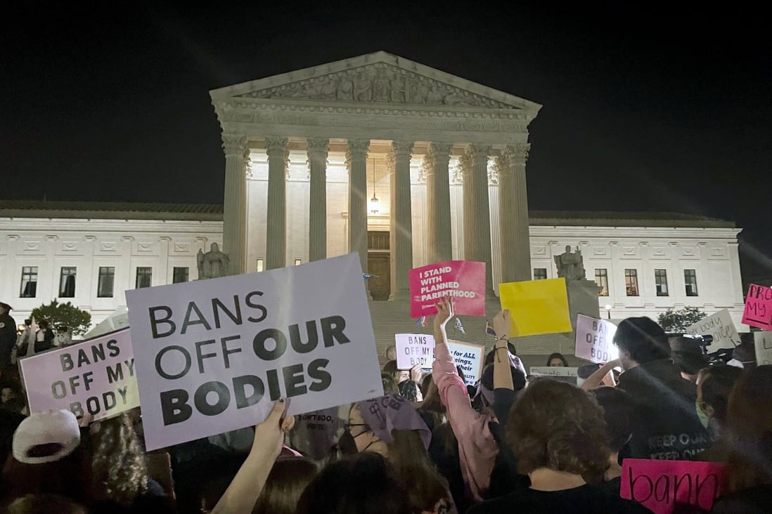 A crowd of people gather outside the Supreme Court in Washington on Monday night. Photo: AP 