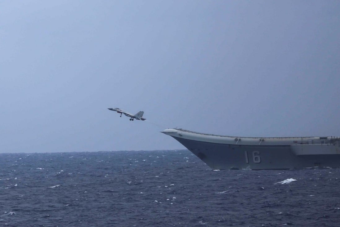 A Chinese carrier-based J-15 fighter takes off from the Liaoning on Tuesday. Photo: Japan Ministry of Defence
