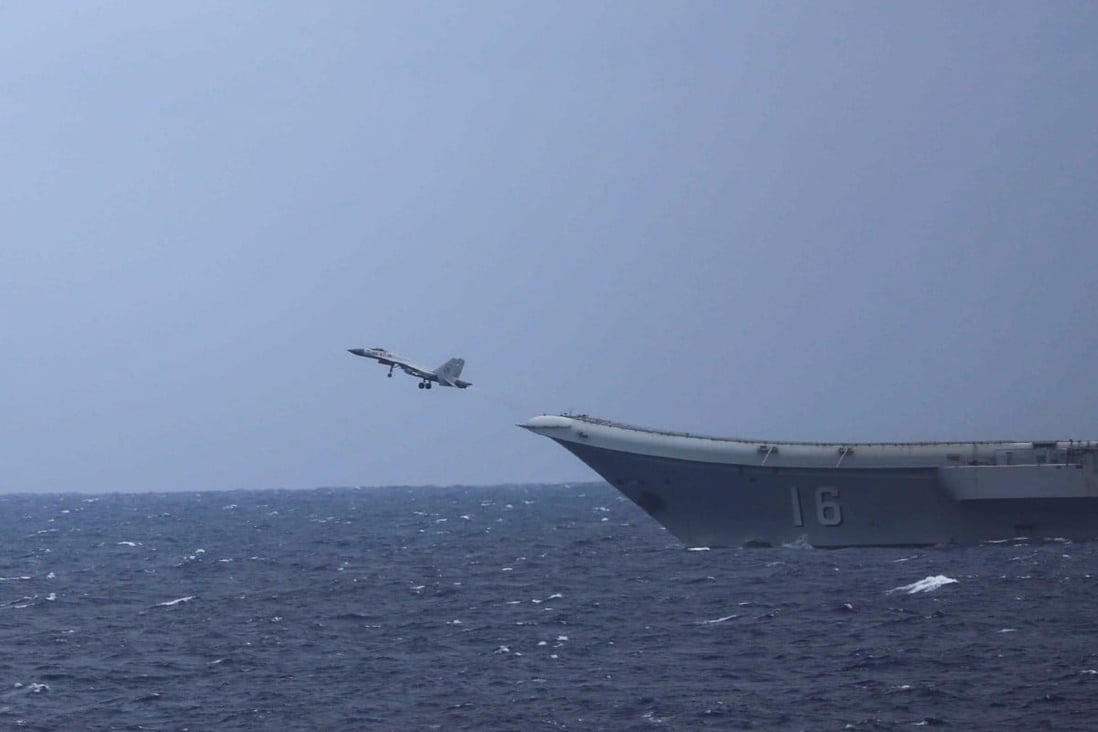 A Chinese carrier-based J-15 fighter takes off from the Liaoning on Tuesday. Photo: Japan Ministry of Defence