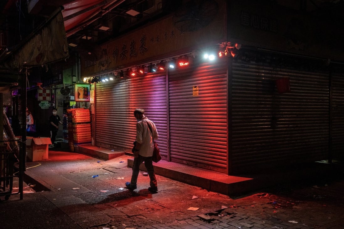 A man walks past a closed shop in Hong Kong on April 30. Falling growth figures could be a harbinger of continuing weakness. Photo: Bloomberg