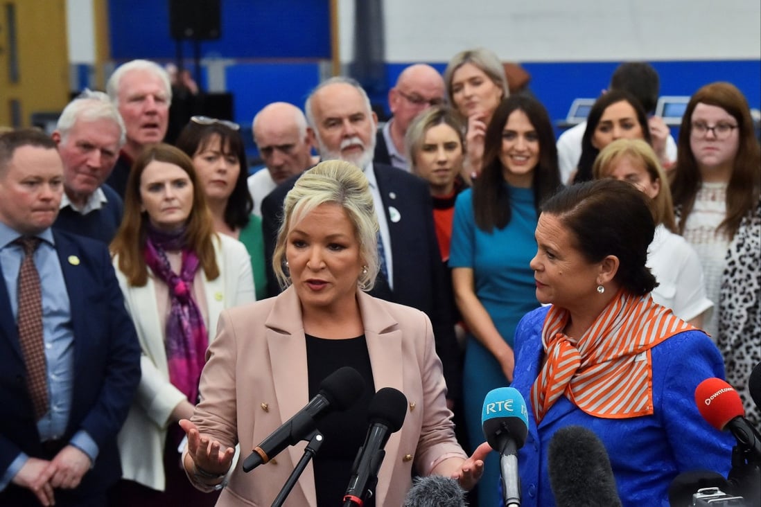Sinn Fein deputy leader Michelle O’Neill, centre, speaks to the media next to party leader Mary Louise McDonald, right, in Magherafelt, Northern Ireland on May 7. Photo: Reuters