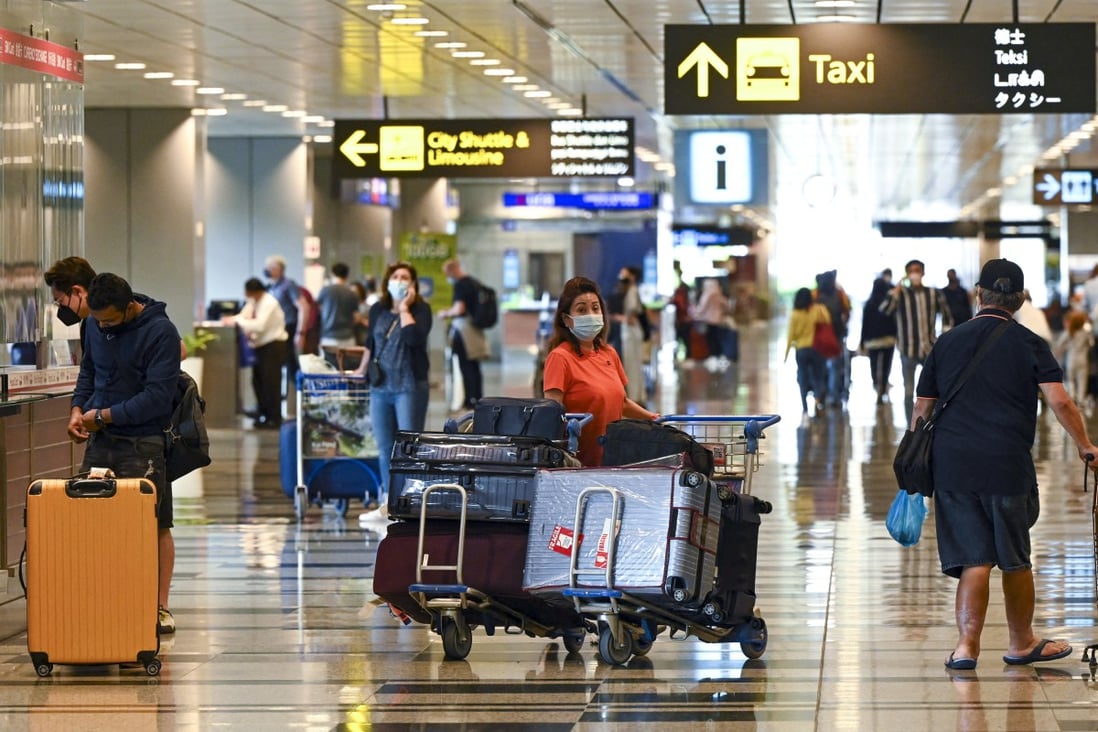 Travellers arrive at Singapore’s Changi Airport. Visitors are flocking to the quarantine-free city state. Photo: AFP