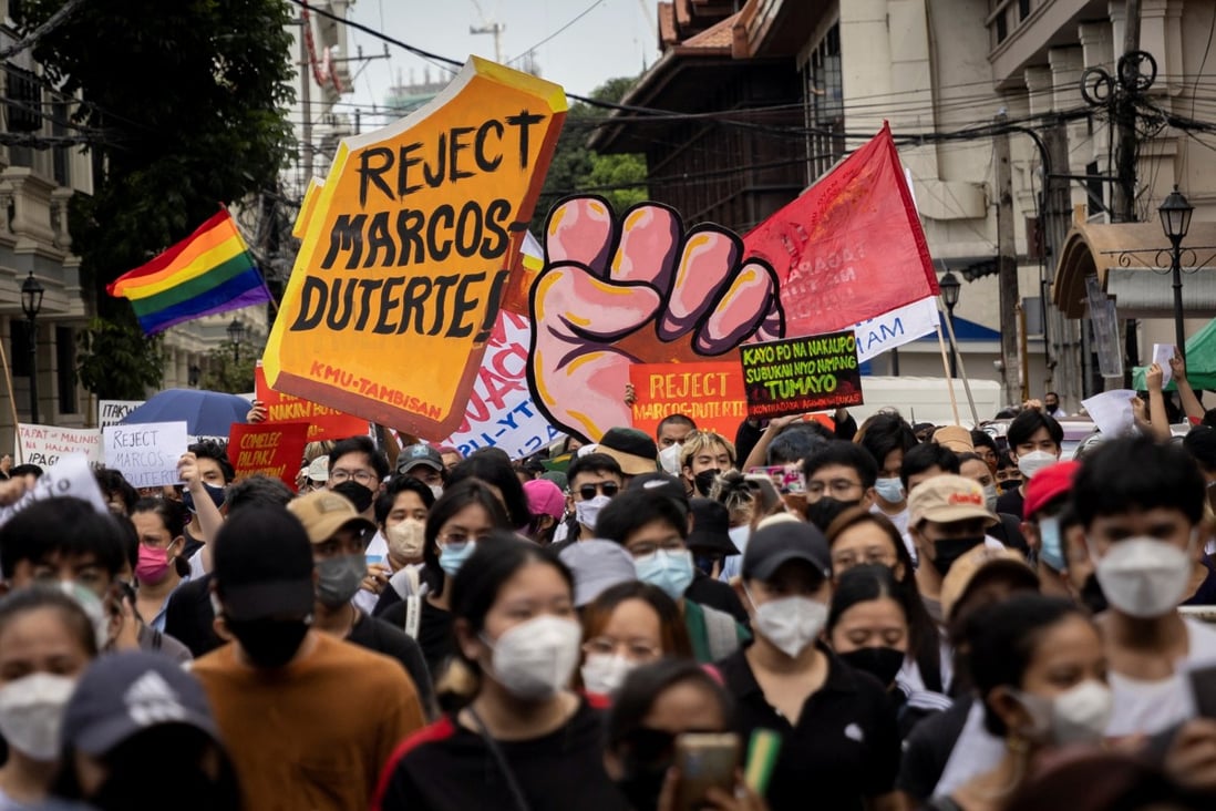 Students and activists march in Manila outside the Commission on Elections on May 10, 2022. Photo: Reuters