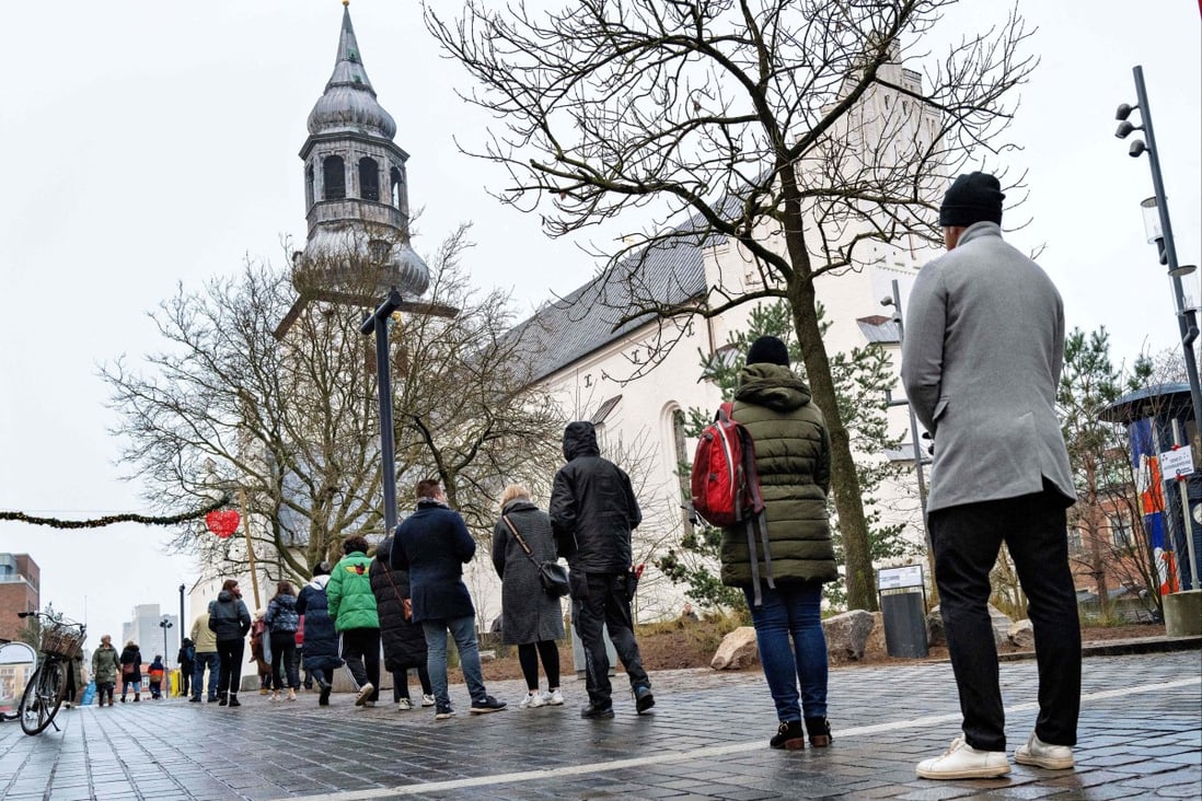 People queuing for a rapid test in Aalborg, Denmark in December 2021. File photo: AFP