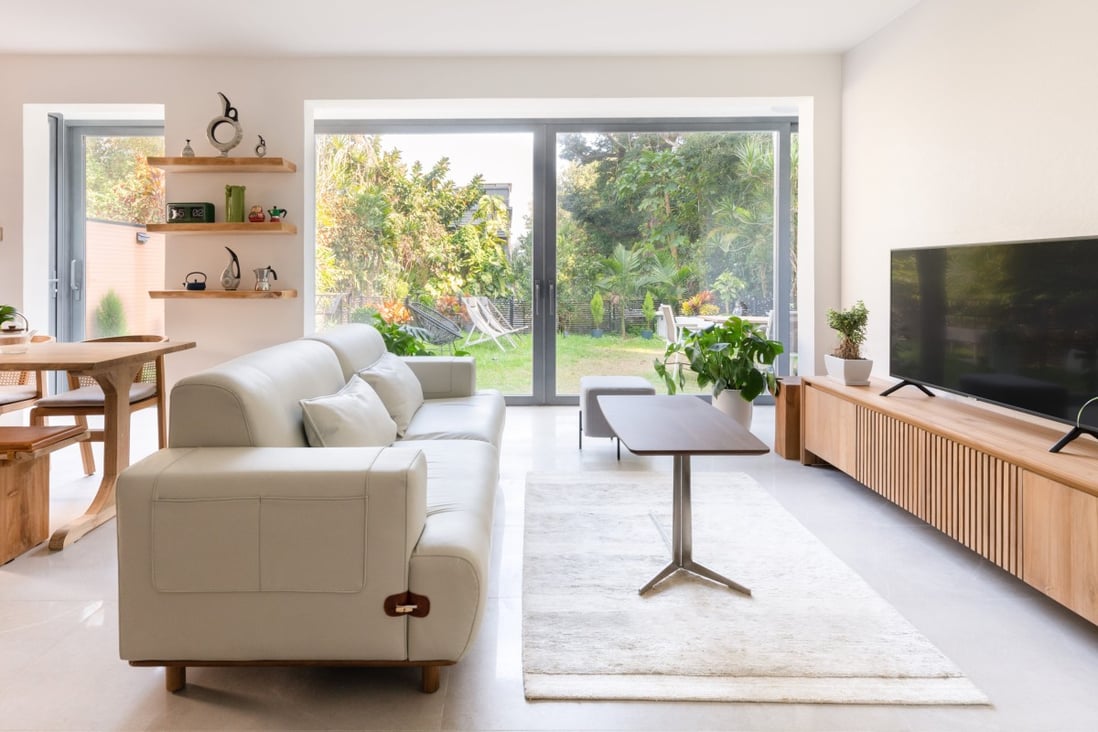 A neutral background makes the warm woods really pop in a furniture store owner’s Clear Water Bay flat. Photo: King Cheung