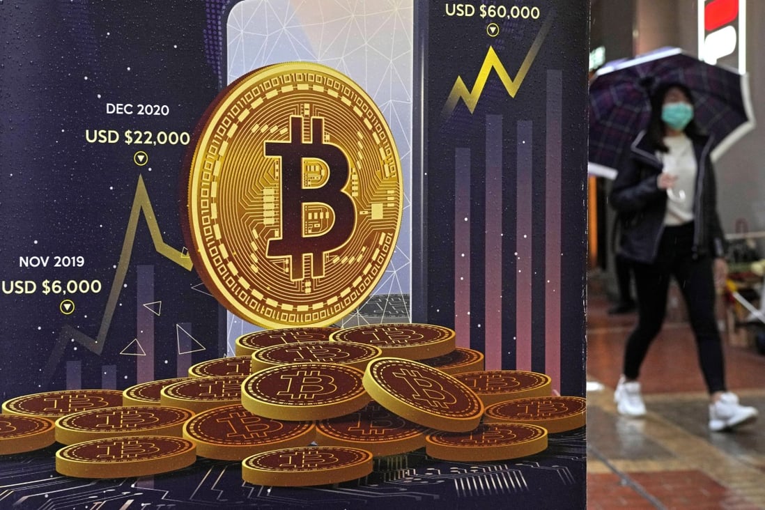 An advertisement for Bitcoin cryptocurrency is displayed on a street in Hong Kong. A global cryptocurrency sell-off has drawn the interest of Chinese social media users despite a ban in crypto trading in the country. Photo: AP Photo