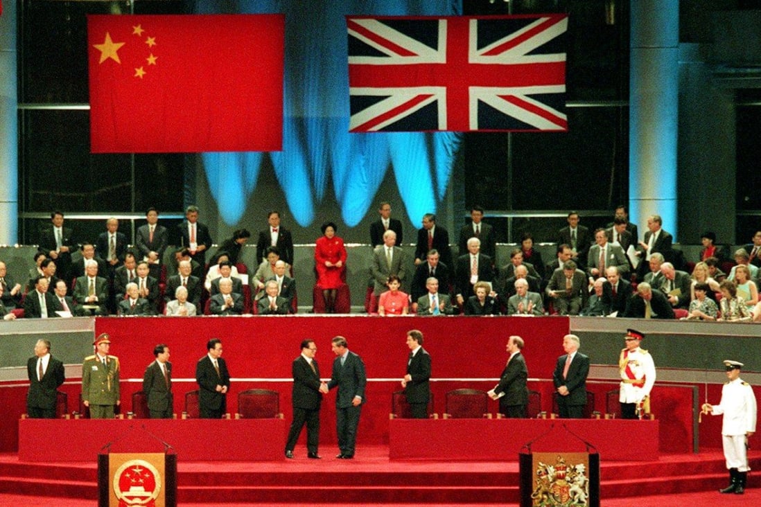 Jiang Zemin and Prince Charles mark Hong Kong’s return to Chinese sovereignty with a shake of hands as British and mainland leaders look on. Photo: Robert Ng