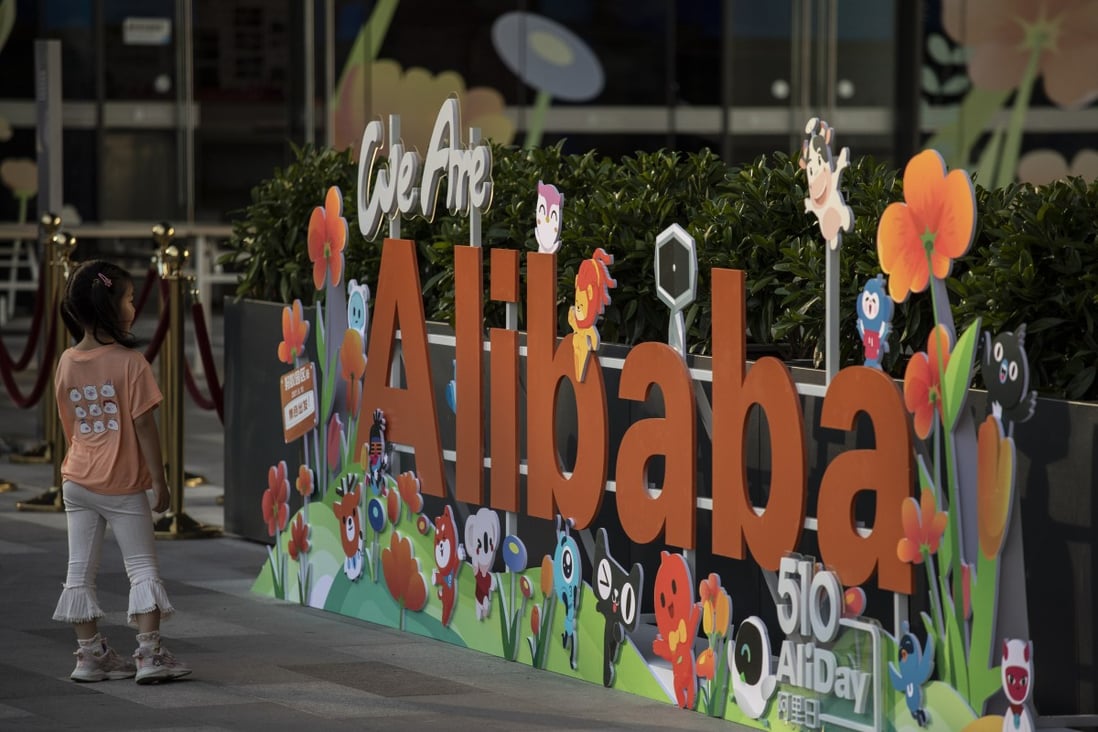 A child views a sign of Alibaba Group Holding's at its headquarters in Hangzhou, capital of eastern Zhejiang province, on May 8, 2021. Photo: Bloomberg